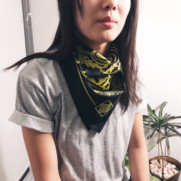 Woman wearing a bandana around her neck