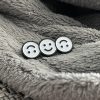 three smiley faces where the first and third one are upside down