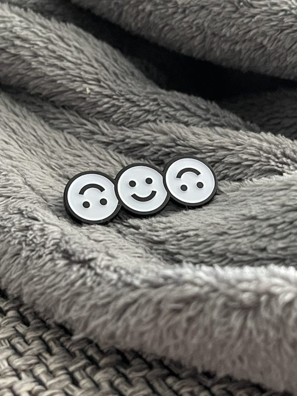 three smiley faces where the first and third one are upside down
